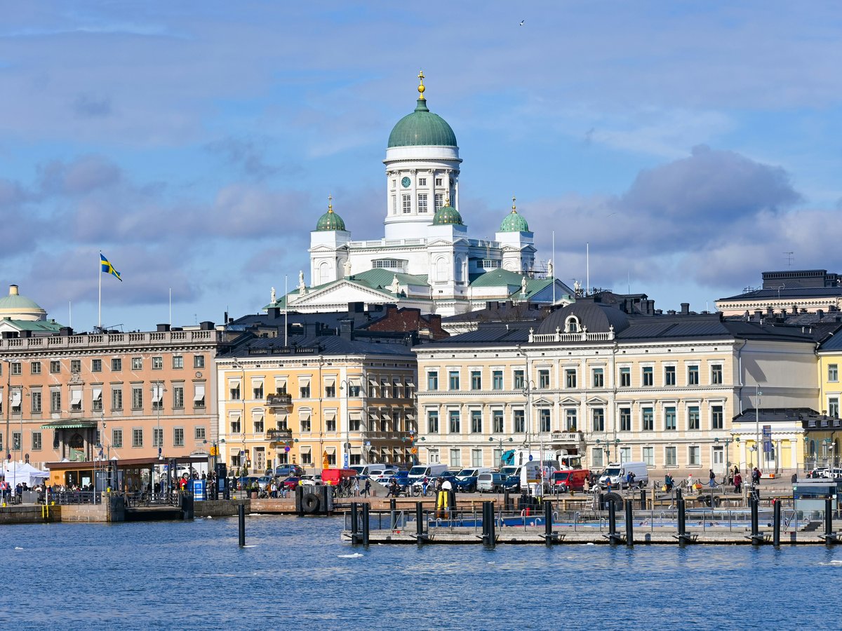 a large building with a green dome on top of it