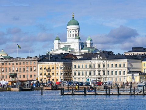a large building with a green dome on top of it