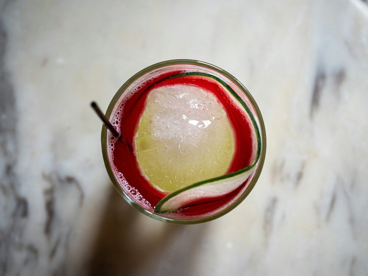 a close up of a drink in a glass on a table