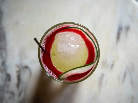 a close up of a drink in a glass on a table