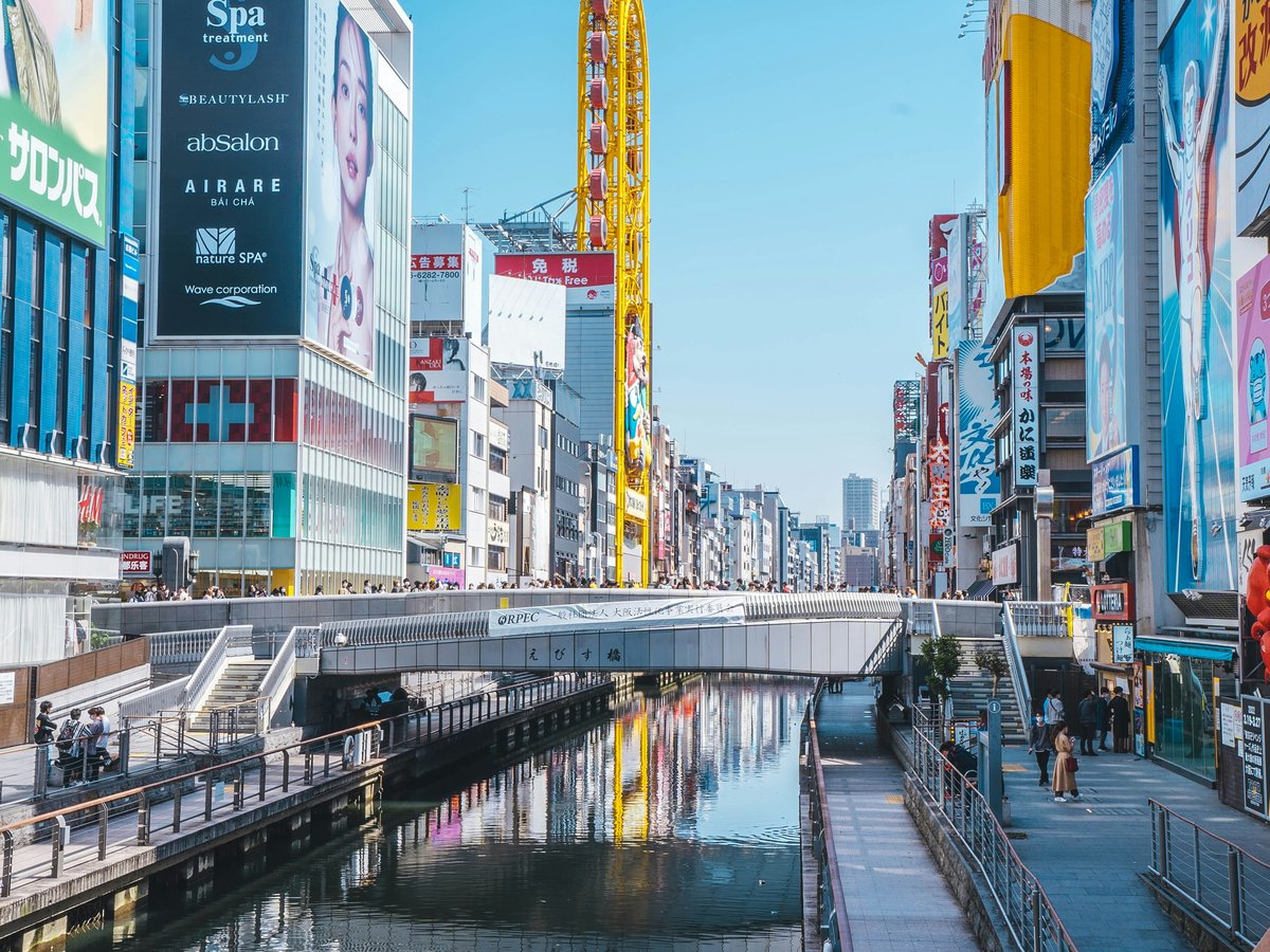 a river running through a city next to tall buildings