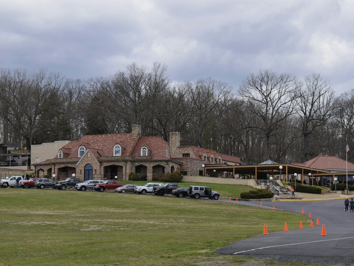 a lot of cars parked in front of a building