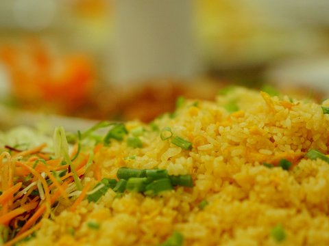 a close up of a plate of rice and vegetables