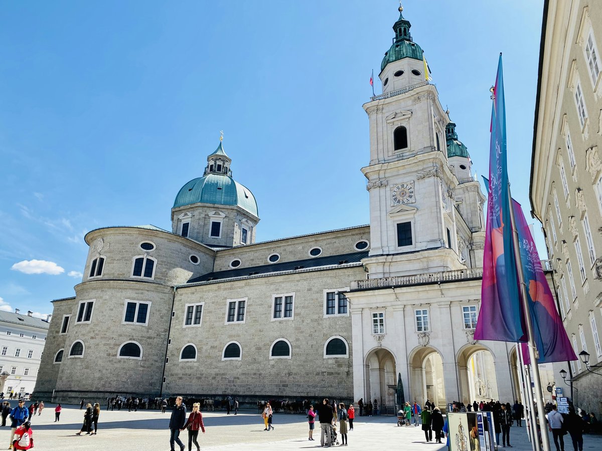 a large white building with a blue dome on top of it