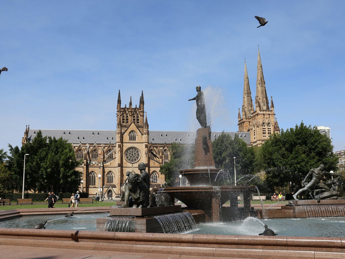Fountain and cathedral on a sunny day