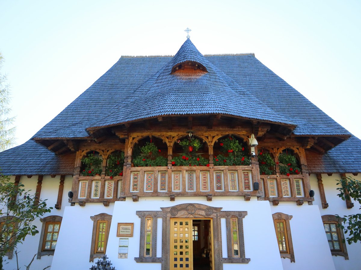 A large white building with a blue roof