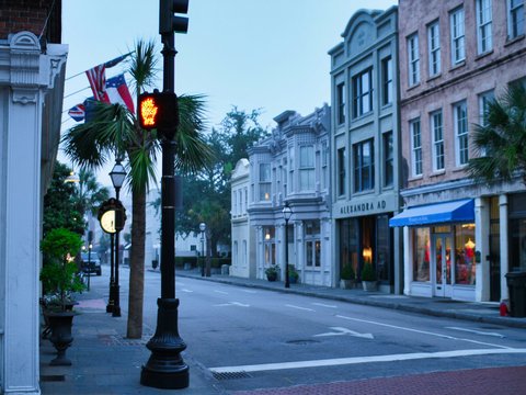 Historic street with colorful buildings and palm trees