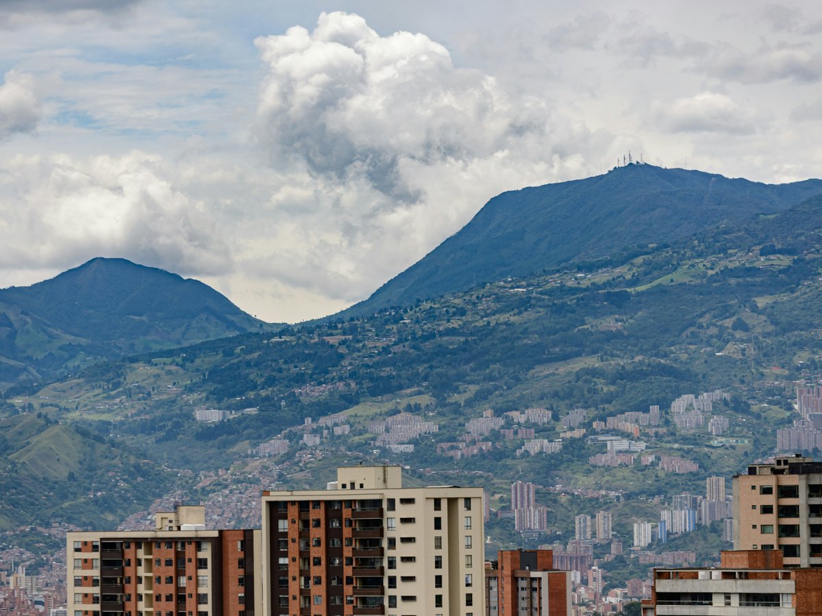 a city with mountains in the background