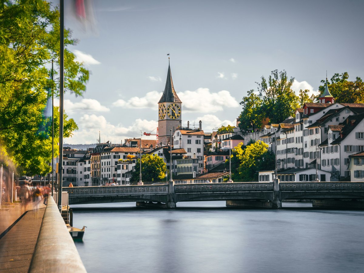 a bridge over a river with buildings on either side of it