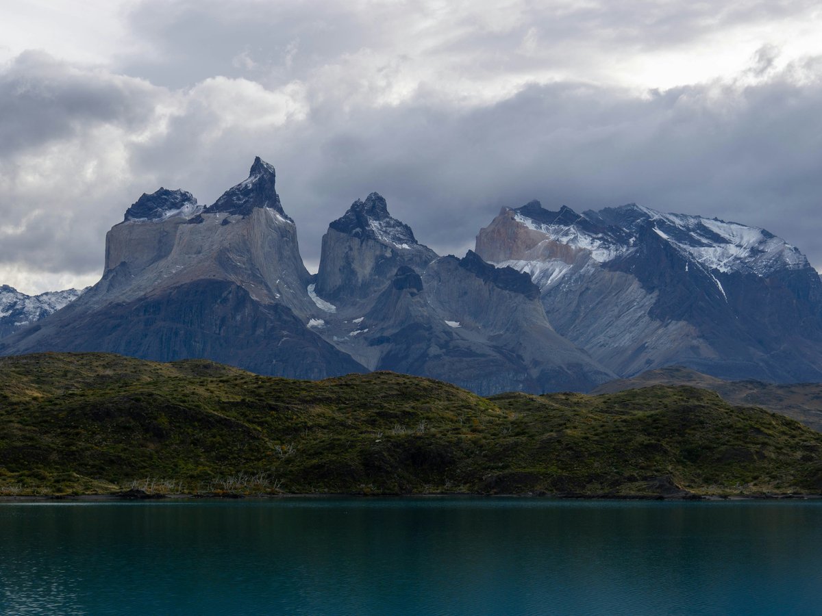 Mountains and a lake under a cloudy sky