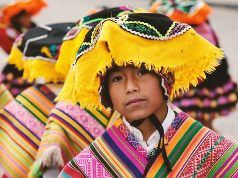 boy in traditional costume in shallow focus photography