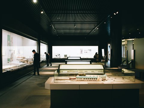 man standing near the glass wall