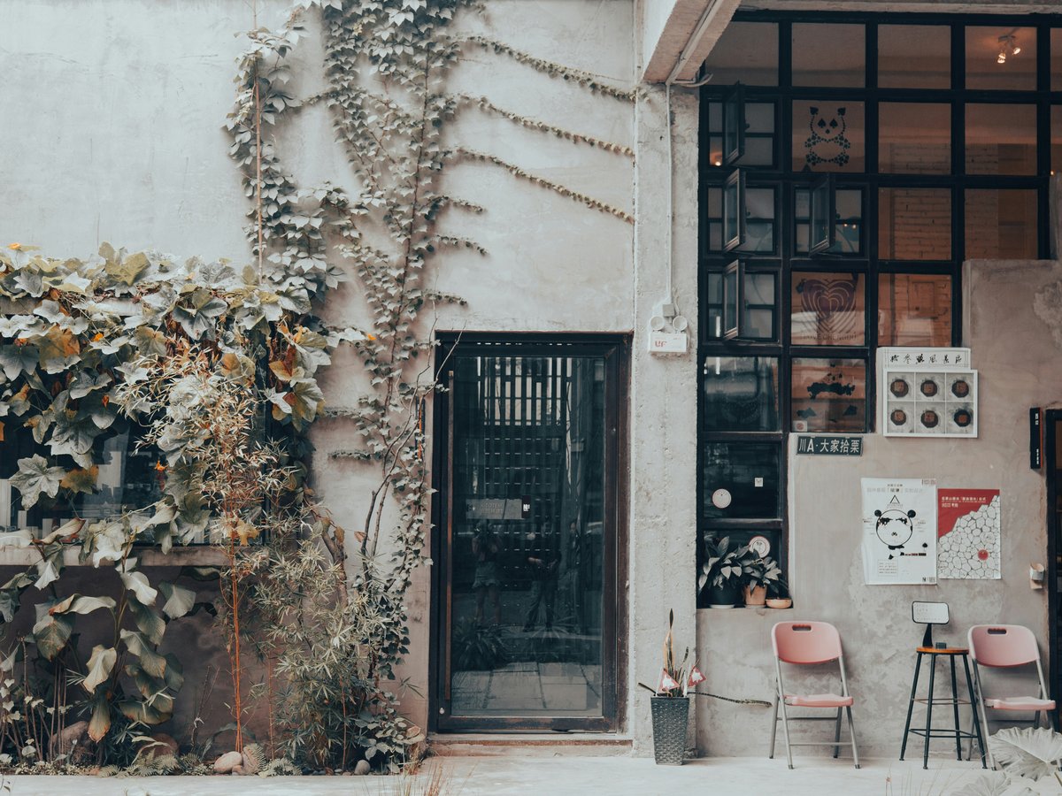 a building with chairs and tables outside