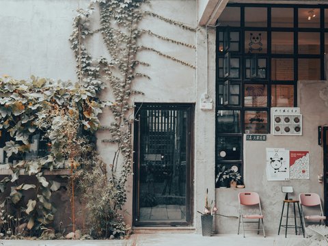a building with chairs and tables outside