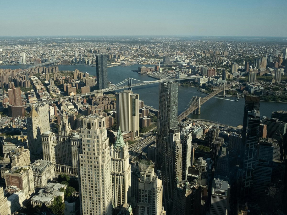 An aerial view of a city with tall buildings