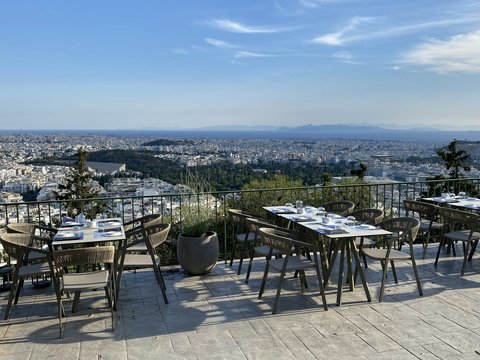 a restaurant with a view of the city
