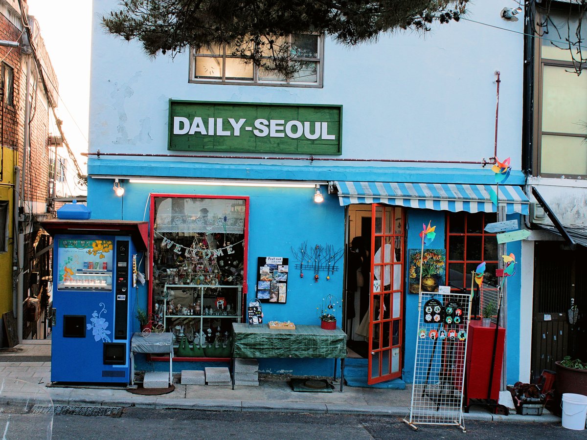 a store front with a vending machine in front of it