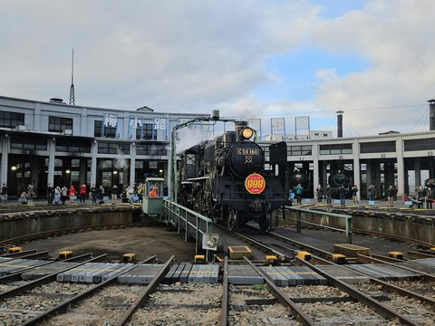 a train on a train track in a train station