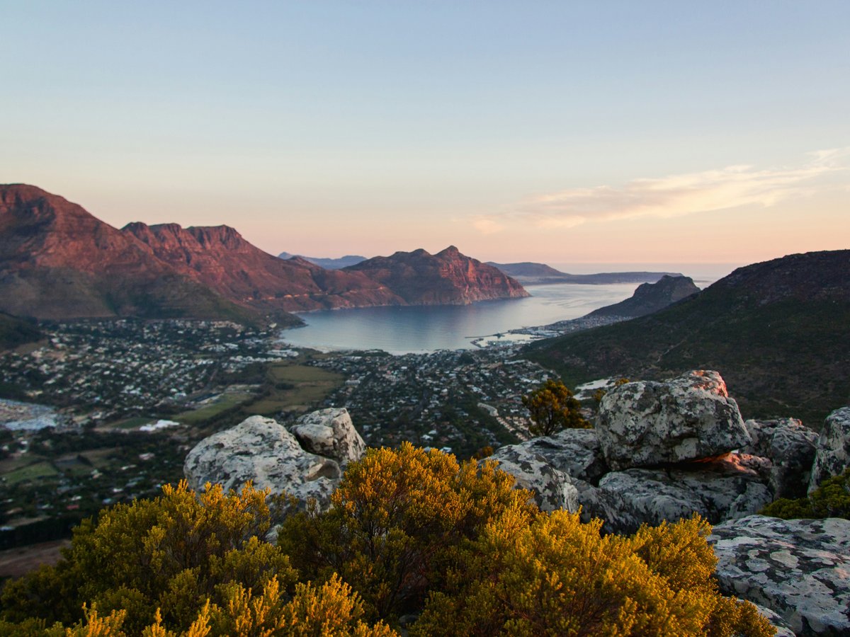 body of water, city, and mountain