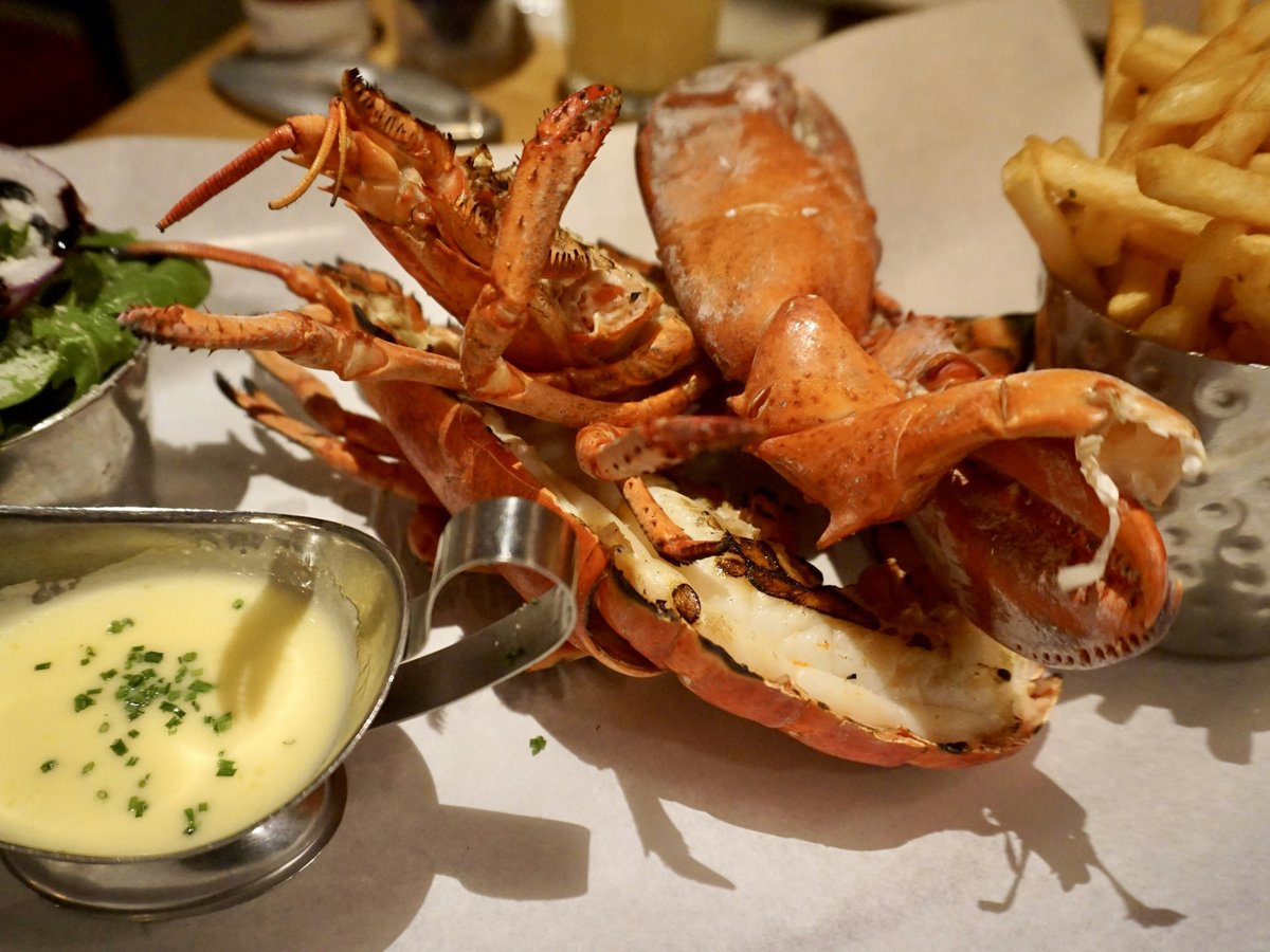 a plate of food with a crab and fries