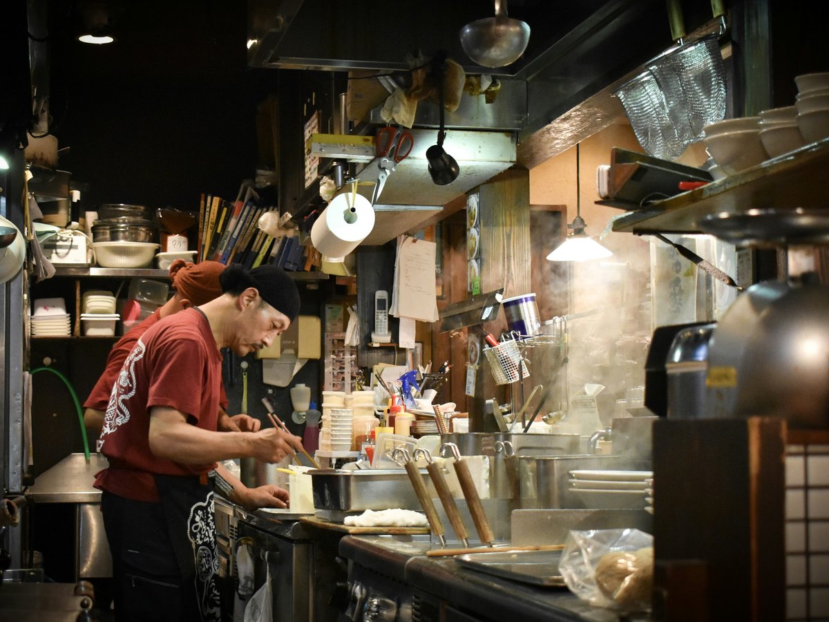 man cooking inside kitchen