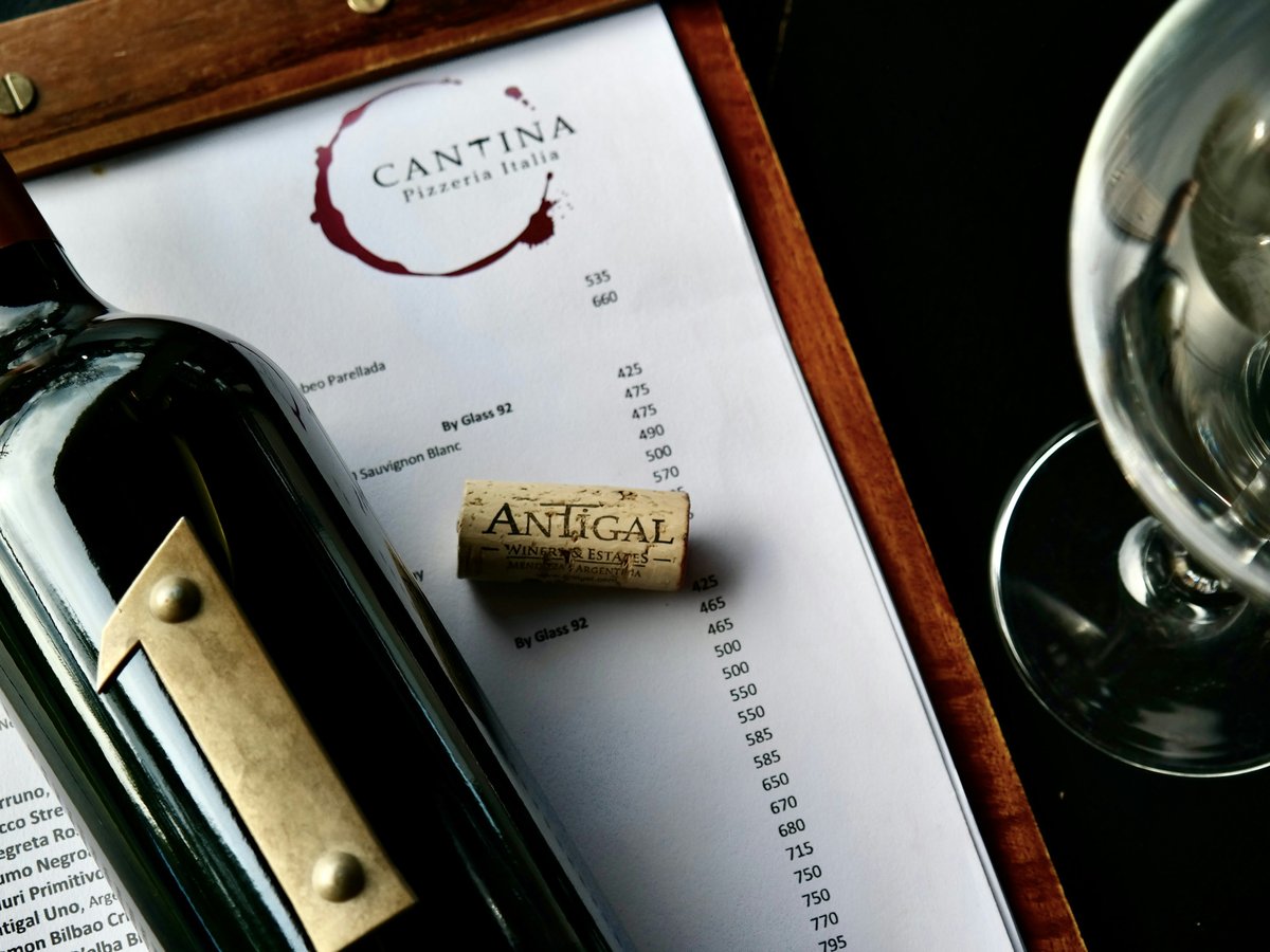 a pen and a glass on a table