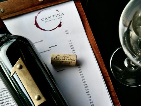 a pen and a glass on a table