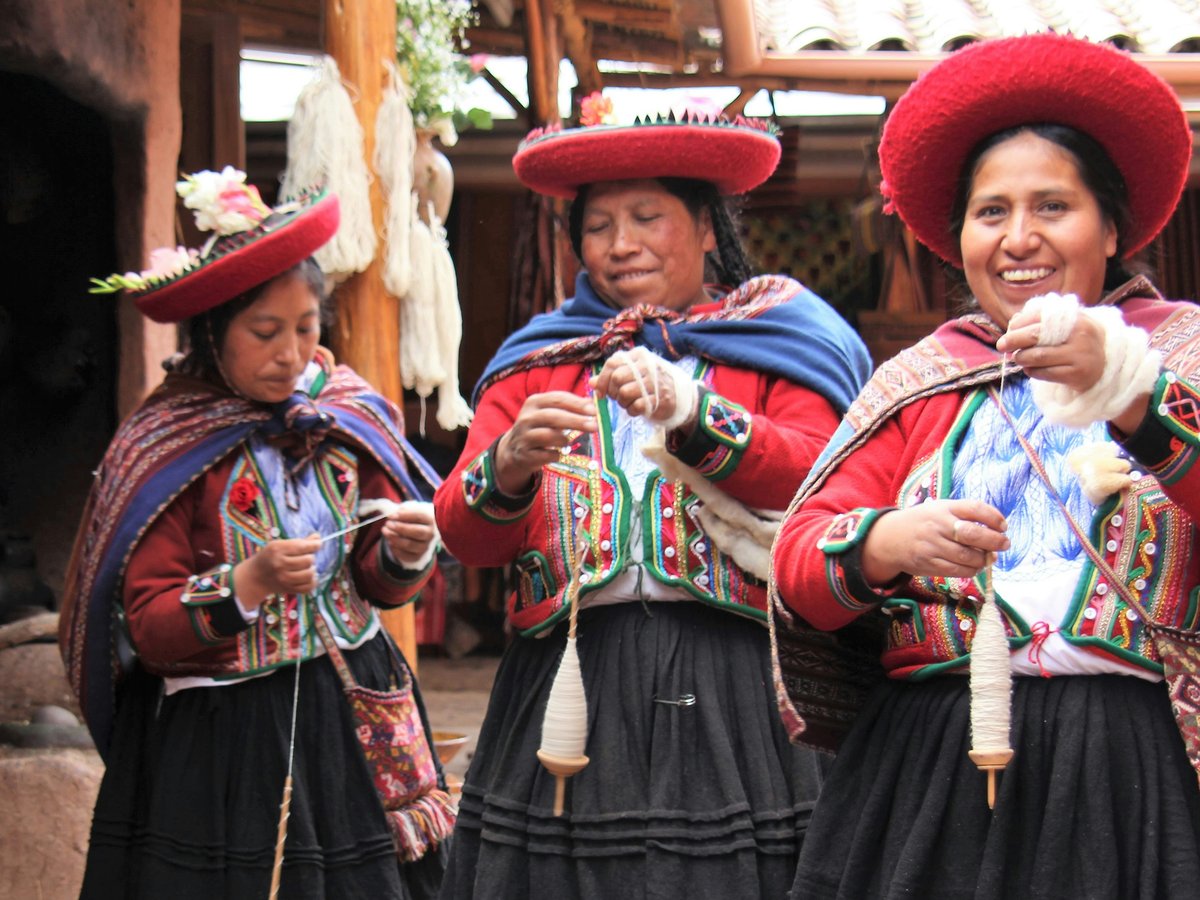 woman in blue and red dress wearing red and white hat