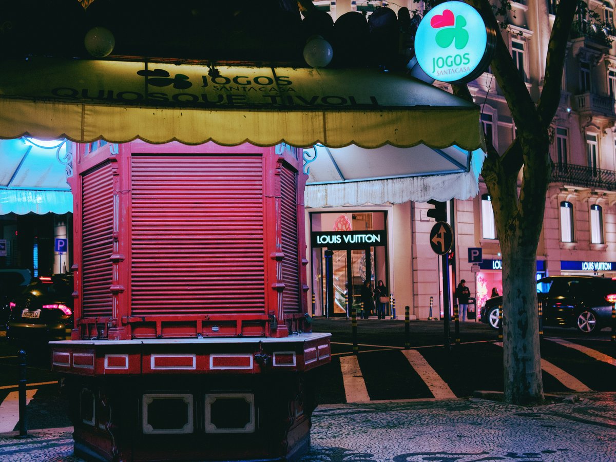 a red and yellow building on a city street