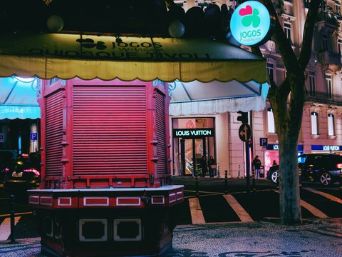 a red and yellow building on a city street