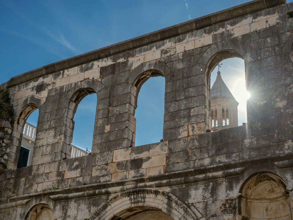 the sun shines through the windows of an old building