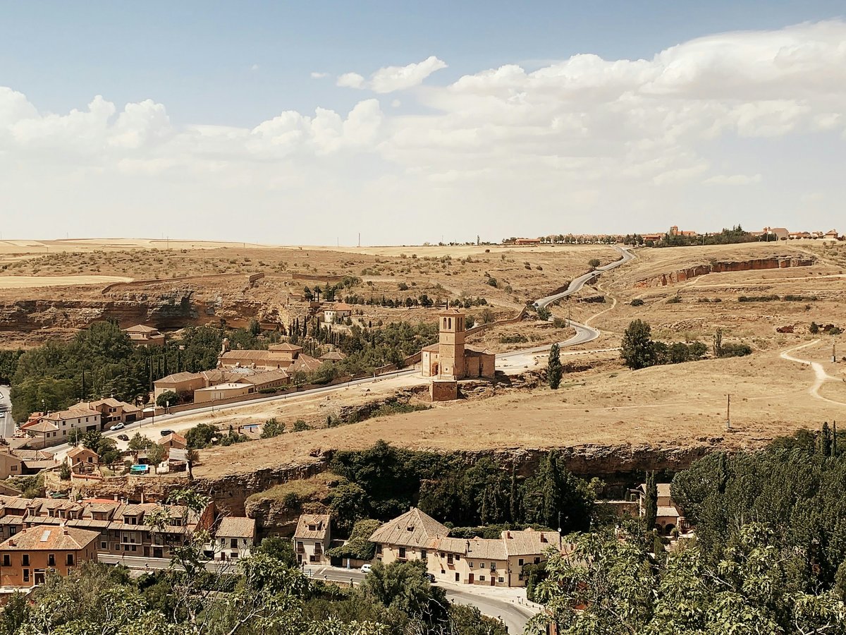 A picturesque village lies nestled in the landscape.