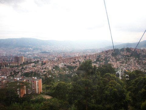 a view of a city from a cable car