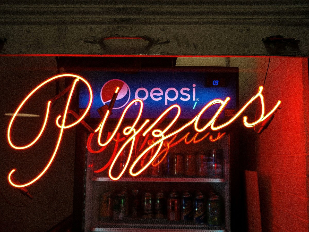 lighted pizzas neon light signage