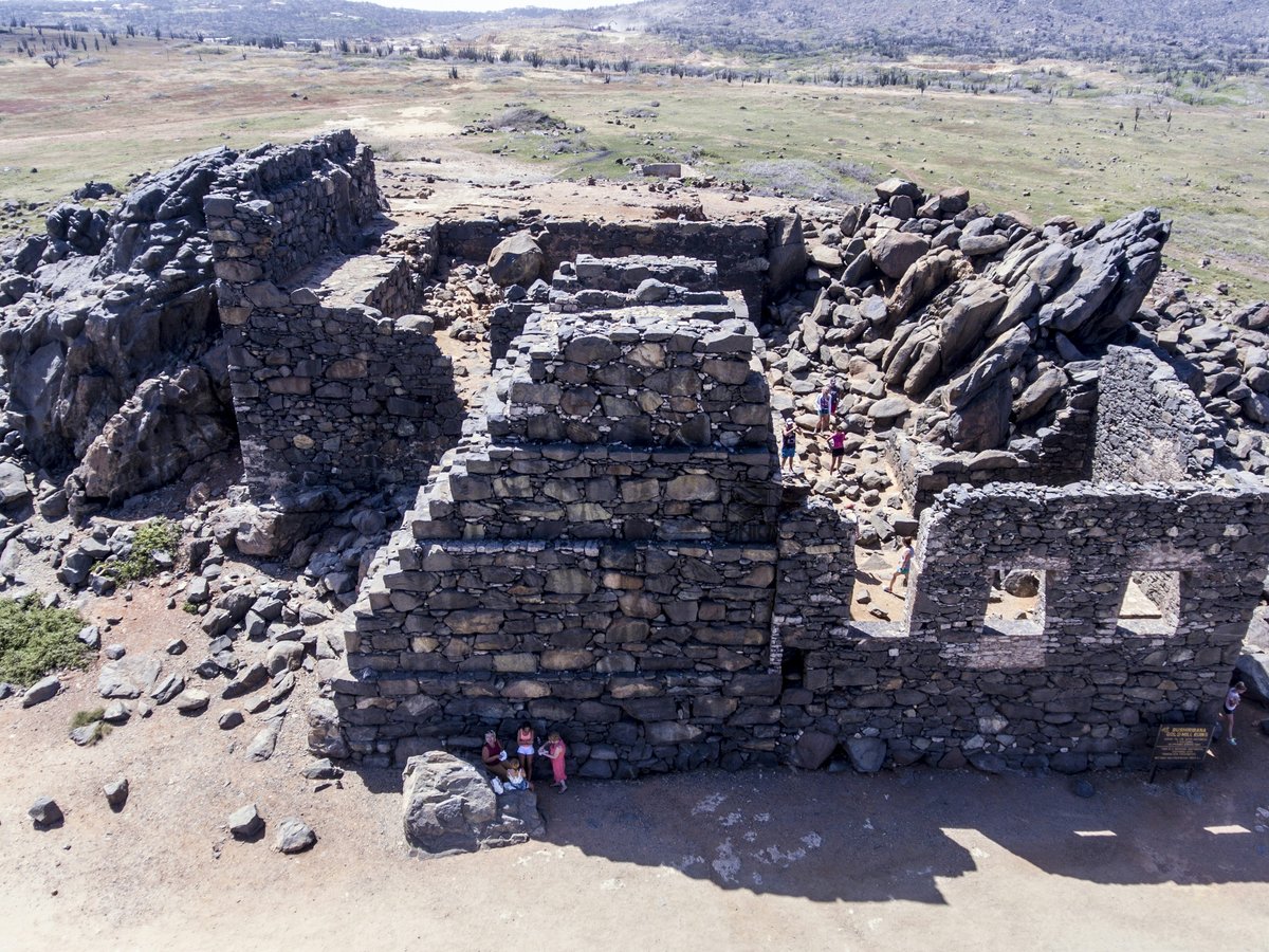 a stone building on a rocky hill