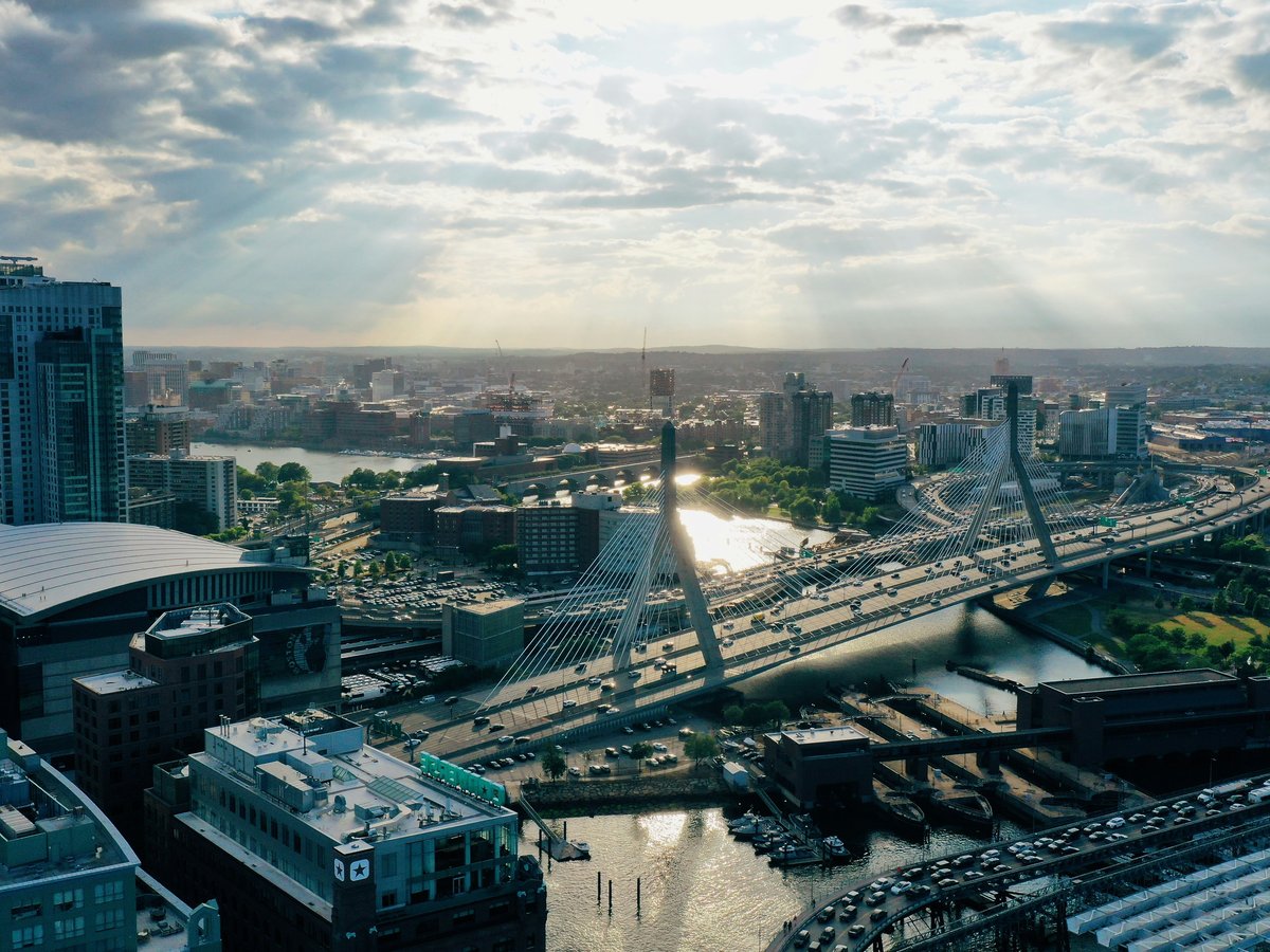 a view of a city with a bridge and a river