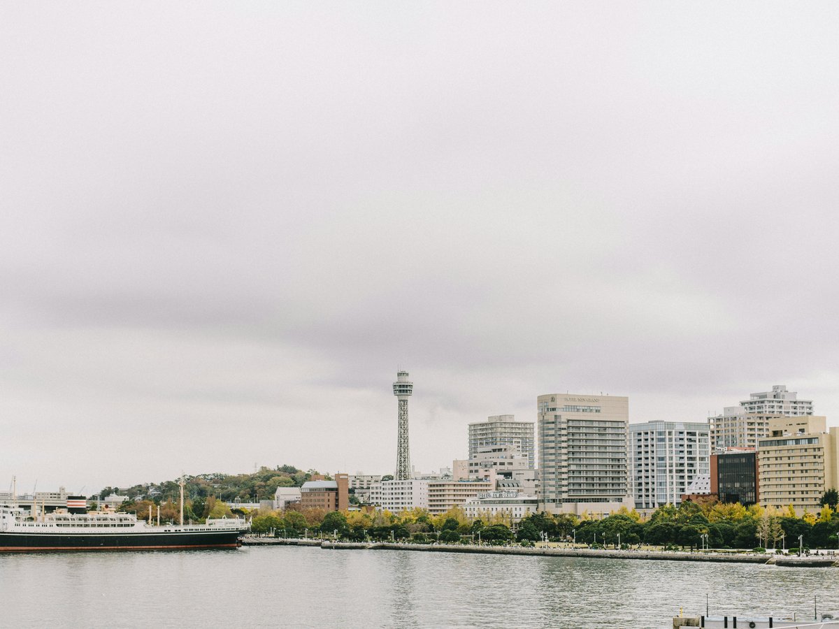 a large body of water with a city in the background