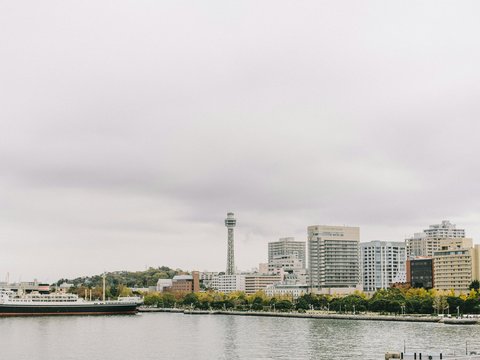 a large body of water with a city in the background