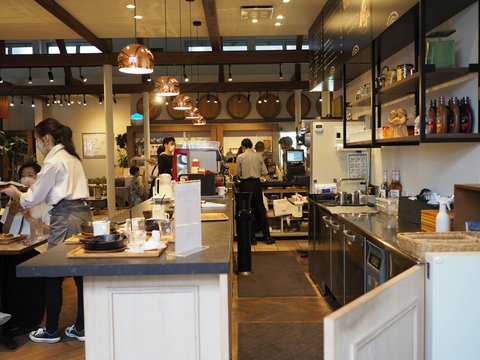 a group of people stand in a kitchen