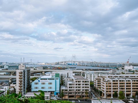 Cityscape with buildings and a bridge in the distance