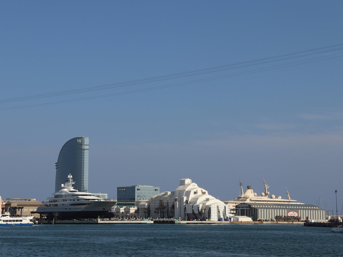 a large body of water with a city in the background