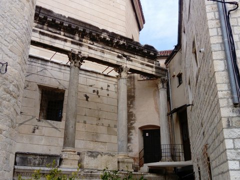 an old building with a staircase going up to it