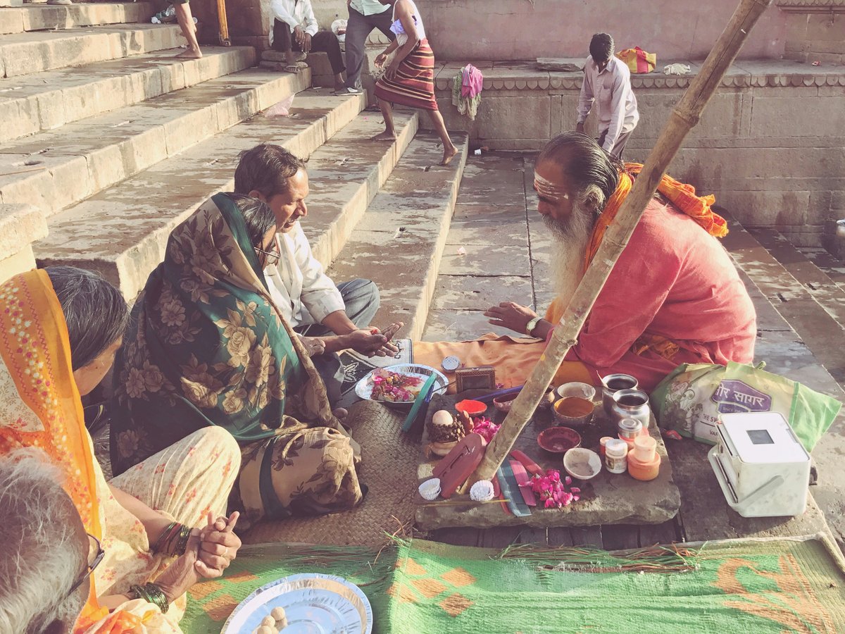 a group of people sitting on the ground