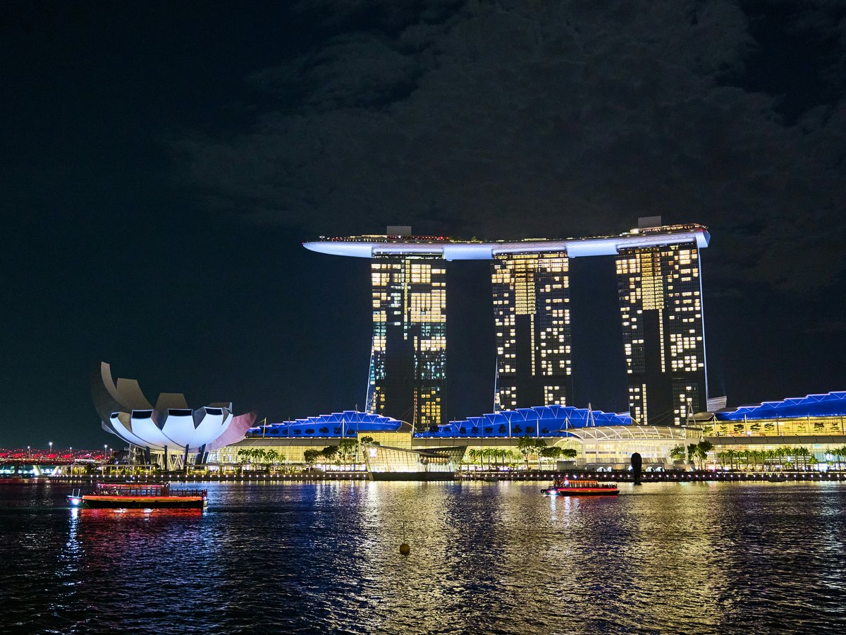 A large body of water with a bunch of buildings in the background