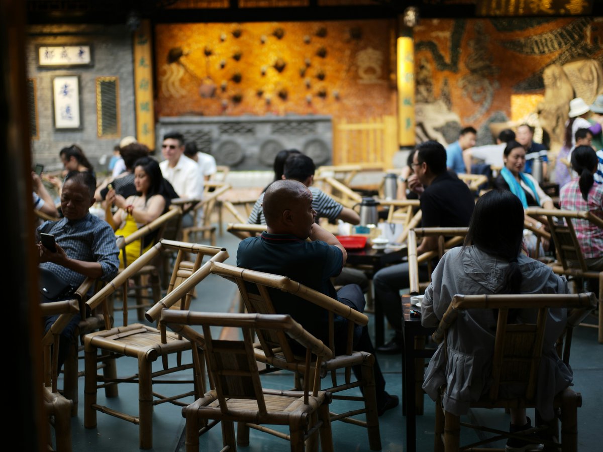 People dining in a dimly lit, ornate restaurant