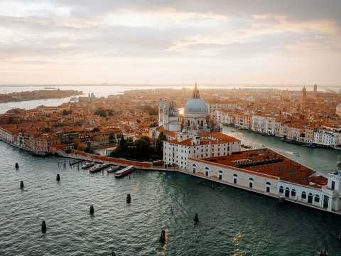 white and brown dome building near body of water during daytime