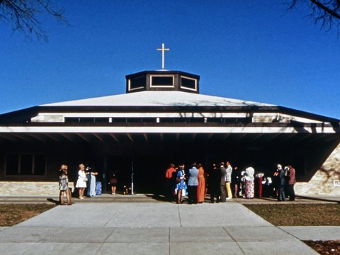 a group of people standing outside a building