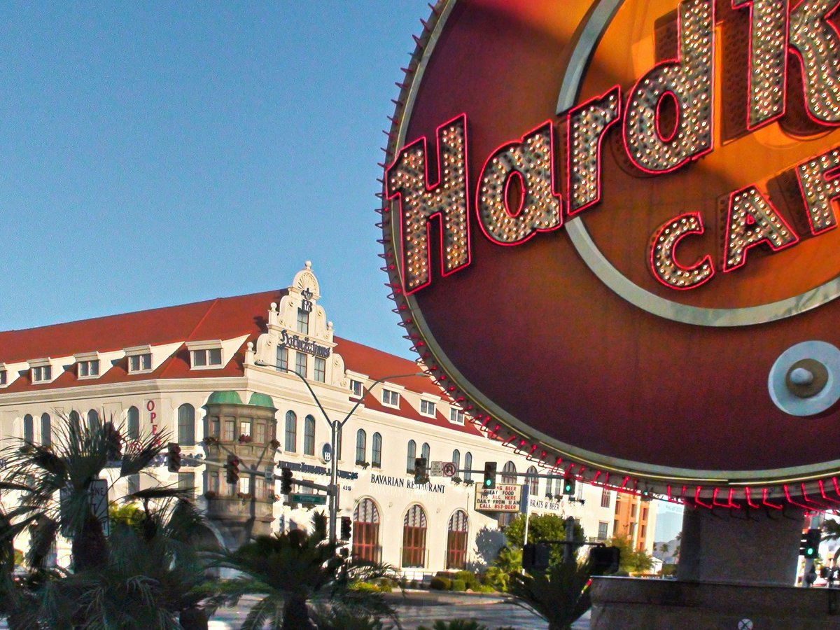 A large sign for a restaurant in front of a building