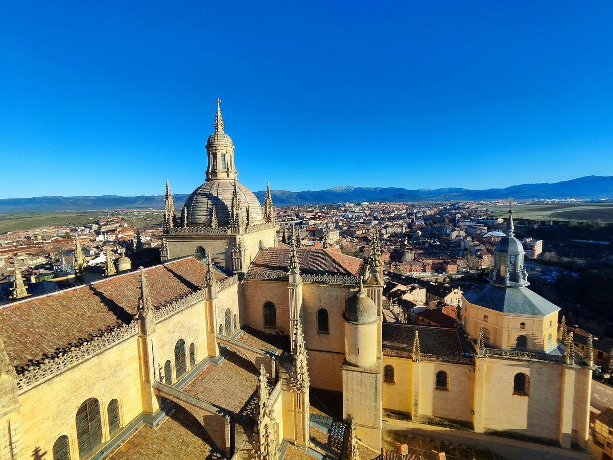 an aerial view of a city with a cathedral
