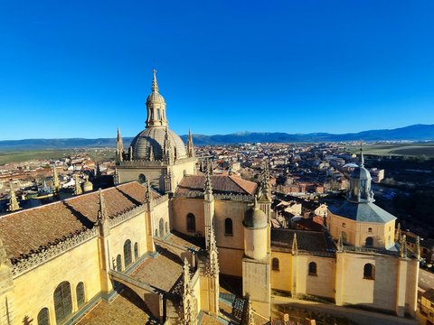 an aerial view of a city with a cathedral